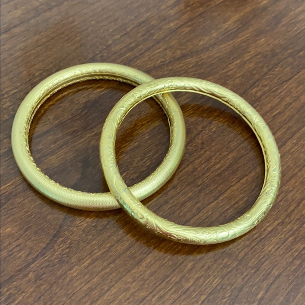 Set of Gold Toned Bracelets.